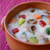Crema di polenta con acciughe e verdure