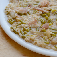 Risotto con fagiolini e crudo mantecato alla scamorza